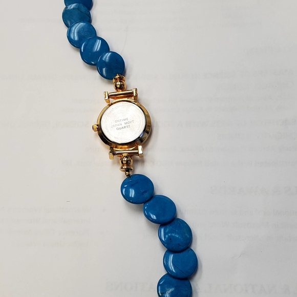 ON TIME WATCH GOLDTONE WITH MOP FACE AND TURQUOISE BAND 8in. - Picture 3 of 4